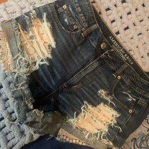 American Eagle distressed shorts with lace detailing. NWT